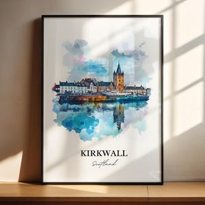 May include: A watercolor painting of the Kirkwall skyline in Scotland. The painting features a tall church tower with a pointed roof, surrounded by other buildings and a body of water. The painting is framed in a black frame.