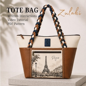 May include: A tote bag with a cream upper and brown lower section. It has a braided handle in blue, brown, and cream. The front pocket shows a black and white illustration of the Eiffel Tower with the word "Paris". The bag is a PDF pattern.