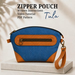 May include: A blue corduroy zipper pouch with tan textured accents, a front zippered pocket, and a detachable wrist strap. The text reads: ZIPPER POUCH, Written Instructions, Video Tutorial, PDF Pattern, Tula.