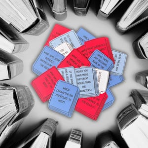 May include: A cluster of red and blue cards shaped like books, each with text, encircled by a ring of hardback books. The cards pose questions about reading, including "Which character did you relate to most?"