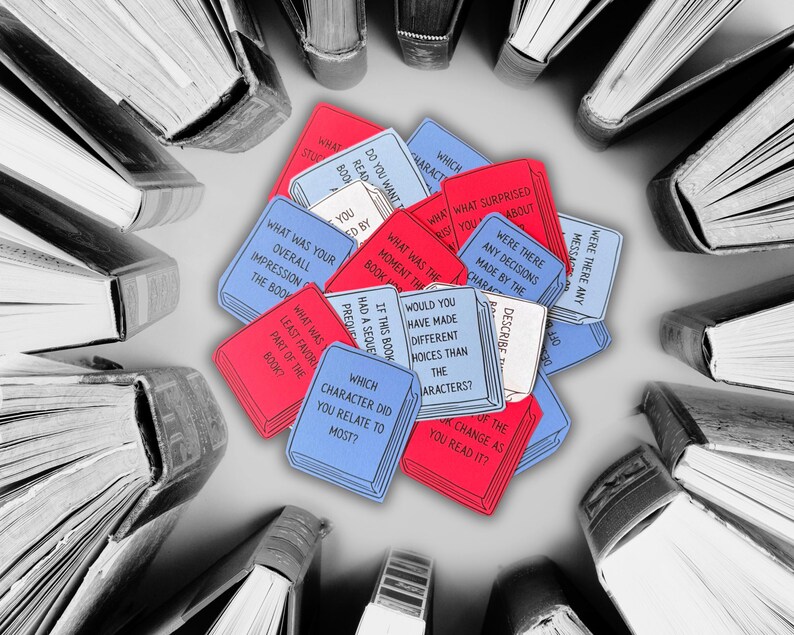 May include: A cluster of red and blue cards shaped like books, each with text, encircled by a ring of hardback books. The cards pose questions about reading, including "Which character did you relate to most?"