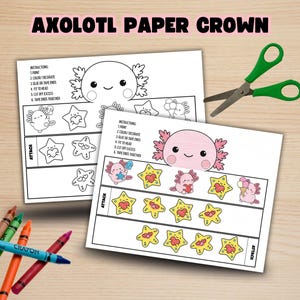 May include: Two sheets of paper featuring an axolotl crown template with instructions, one colored and one black and white. Green scissors are positioned above the papers, and four crayons in brown, green, orange, and pink lie below them.