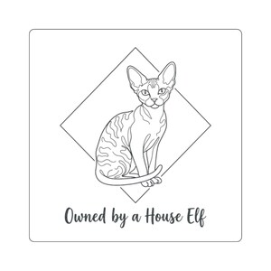 May include: A square sticker featuring a black line art illustration of a cat sitting inside a diamond shape. The cat has large ears and a patterned coat. Below the diamond, the text reads Owned by a House Elf in a dark cursive font.