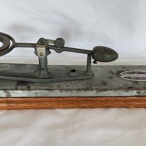 Vintage Reliable Egg Scale metal mounted on wood