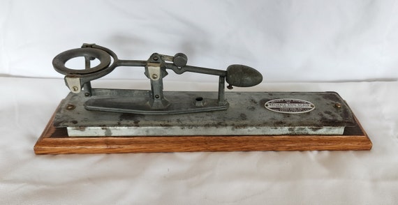 Vintage Reliable Egg Scale metal mounted on wood