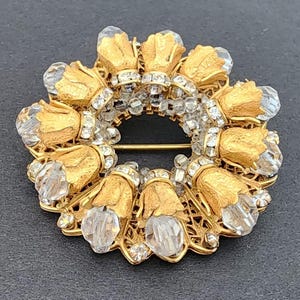 Vintage Miriam Haskell rhinestone crystal gold tone wreath brooch signed 1950s