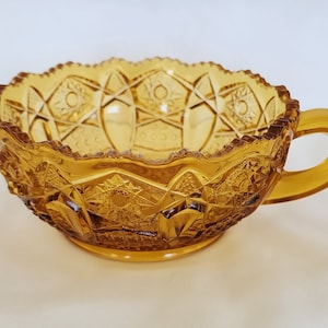 LE Smith amber Quintec Heritage pattern handled nappy glass dish with sawtooth edge 5 1/2 inch