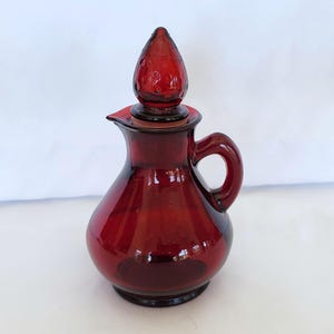 Vintage Avon ruby red cruet bath bottle with strawberry stopper 5 1/4&quot;