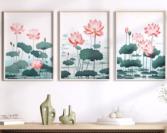 May include: Three framed prints of pink lotus flowers with green leaves against a white background. The prints are hanging on a white wall above a wooden shelf with decorative objects.