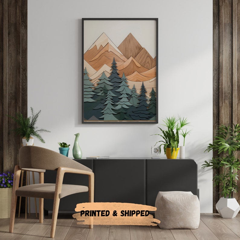 May include: A framed print of a layered wood art piece depicting a mountain range with trees in the foreground. The mountains are in shades of brown and orange, while the trees are in shades of green and blue.
