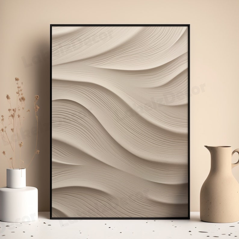 May include: A framed abstract art print with a beige background and a wavy, textured pattern.