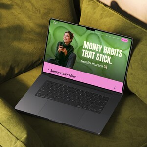 May include: A dark gray laptop displaying a website with the text "MONEY HABITS THAT STICK. Results that last." The website features a woman holding a phone. The laptop is on a green couch.