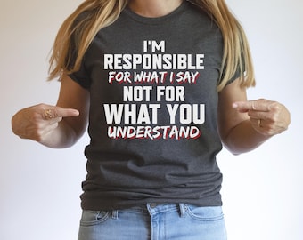 May include: A dark gray t-shirt with the text "I'm responsible for what I say not for what you understand" in white with red highlights.