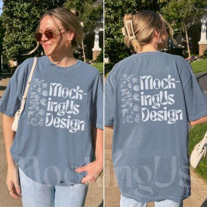 May include: A dusty blue t-shirt with the text "MockingUs Design" in white. The front of the shirt features the text within a floral design. The back of the shirt also has the same text and floral design.