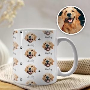 May include: White ceramic mug with a repeating pattern of a golden retriever dog's face and the name "Marley" printed on it.