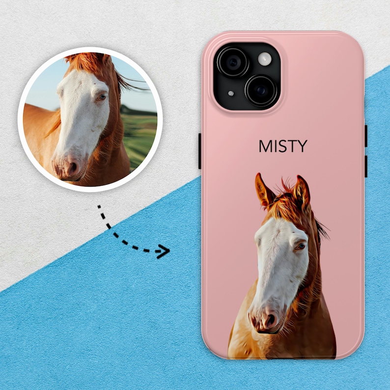 May include: A pink phone case featuring a white horse illustration and the word "Misty" printed on the back. The phone case has a camera lens cutout.