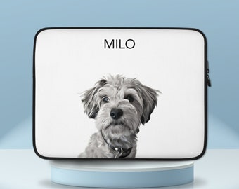 May include: White laptop sleeve with a black border and zipper. The sleeve features a white and gray illustration of a dog with the name "MILO" printed in black text.