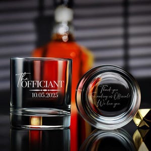 May include: Two clear glass tumblers with engraved text. The first tumbler says "The Officiant 10.05.2025". The second tumbler says "Thank you for making us Official! We love you."