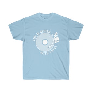 Light blue t-shirt with an intricate turntable graphic, celebrating the nostalgia of vinyl records and music.