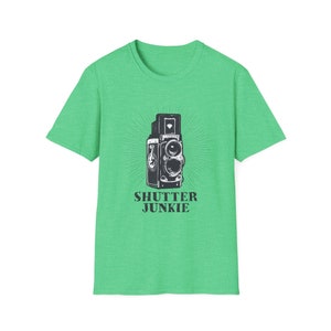 Green t-shirt with a vintage camera graphic and "Shutter Junkie" text.