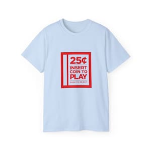 Retro arcade game t-shirt with '25¢ Insert Coin to Play' text in bold red on white background, perfect for video game enthusiasts.