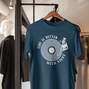 Close-up of vinyl record graphic on blue tee