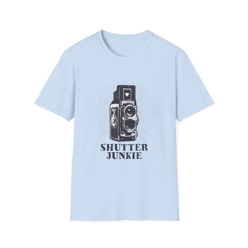 Red t-shirt featuring a vintage camera design and "Shutter Junkie" text.