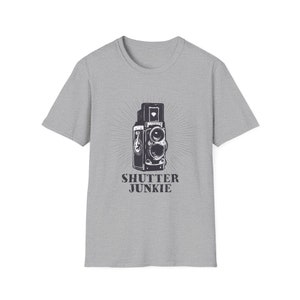 Gray t-shirt with a classic camera illustration and "Shutter Junkie" text.