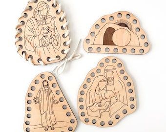 May include: Four wooden religious ornaments with etched illustrations. One shows Jesus with a lamb, another depicts the empty tomb, and two others feature religious figures. Each has a decorative border with holes and white string.