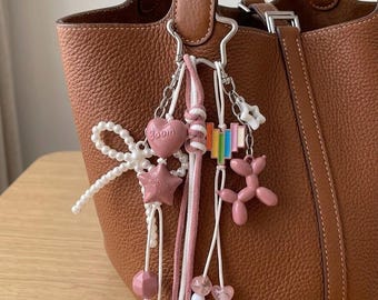 Dusty Pink Coquette Bag Charm - Pearl Bow & Balloon Dog Keychain - Kawaii Y2K Tote Accessory - Chunky Knotted Bag Strap with Rainbow Accent
