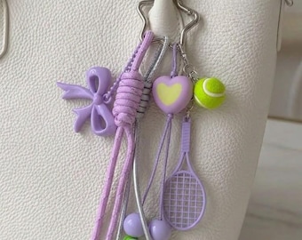 Lilac Tennis Core Bag Charm - Pastel Purple Coquette Bow Keychain - Y2K Sporty Tote Accessory - Chunky Knotted Heart & Racket Strap