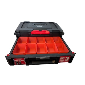May include: A black and red Craftsman toolbox with a drawer that has nine orange compartments. The drawer is open and the lid is partially open. The text "QUICK ACCESS TO TOOLS" and "3 DRAWERS" is visible on the side of the box.