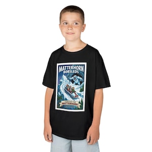 May include: Black t-shirt featuring a vintage-style graphic of a bobsled ride down a snowy mountain, with the text "Matterhorn Bobsleds." The graphic includes a yeti and the words "I Survived the Matterhorn Bobsleds."