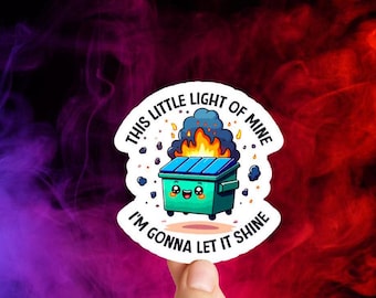 May include: A blue and green cartoon trash can with a smiling face is on fire. The text around the trash can says "This little light of mine I'm gonna let it shine."