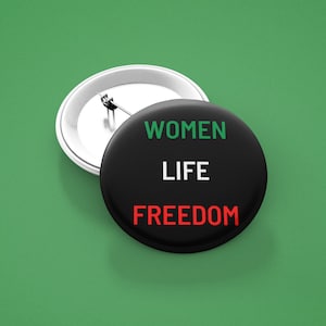 Women life freedom button, simple pin in the colors of the Persian flag. Zan Zendegi azadi badge