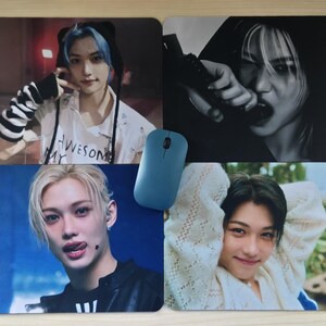 May include: Four rectangular mouse pads featuring images of a person. One pad has the word "AWESOME" on a shirt. A blue wireless mouse is placed on the pads. The pads have a glossy finish.
