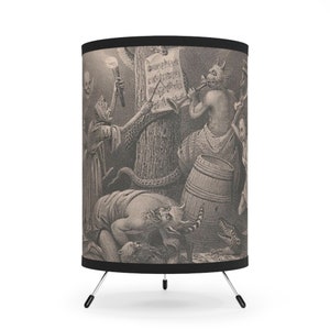 May include: A black and white illustration of a group of fantastical creatures playing music. The creatures are dressed in various costumes and are holding musical instruments. The illustration is printed on a lampshade with a black trim.
