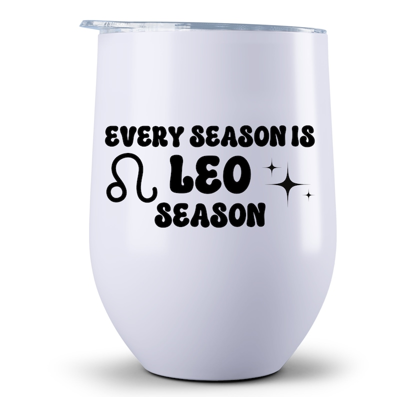 May include: White stainless steel wine tumbler with black text that reads "Every season is Leo season" with a Leo zodiac symbol and stars.