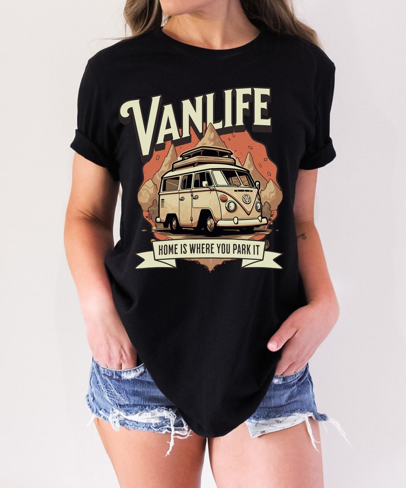 May include: Black t-shirt with a vintage-style illustration of a camper van with the text "Vanlife" and "Home is where you park it".