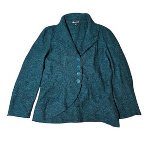 May include: Teal blazer with a textured finish. The jacket has a notched lapel, four teal buttons, and an asymmetrical hem. This long-sleeved jacket is a stylish outerwear option, suitable for various occasions.