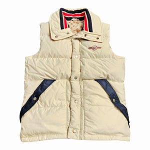 Chaleco acolchado de plumas ARKTIS de los años 80, talla grande para hombre, color crema y azul, con cierre a presión.