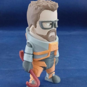 May include: A 3D printed figurine of a character wearing a gray and orange jumpsuit, a brown beard, and black glasses. The character is holding a red crowbar.