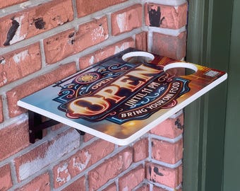 Estante plegable para reparto de comida: bandeja de pared para exteriores con portavasos