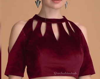 May include: A burgundy velvet top with a high neckline and cut-out shoulder design. The short-sleeved blouse features a fitted silhouette and a keyhole detail at the neckline. The Starfashionhub logo is visible on the bottom right.