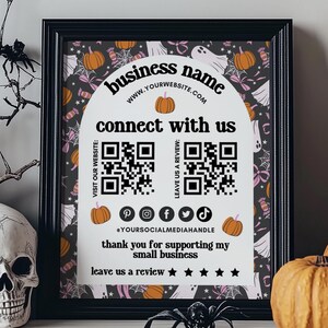 May include: A Halloween-themed business card with a black and white background featuring ghosts, pumpkins, and candy. The card includes the business name, website address, QR codes for visiting the website and leaving a review, social media icons, and the text "connect with us", "thank you for supporting my small business", and "leave us a review".