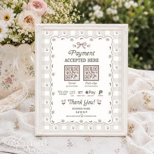 May include: A rectangular white frame containing a payment sign with a light gray gingham background. The sign features a scalloped border, a pink bow, and two QR codes for Venmo and Cash App. It lists payment methods and social media icons.