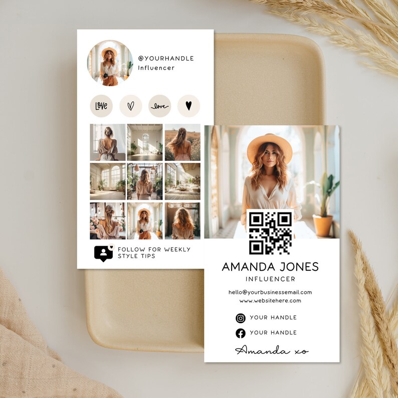 May include: A white card with a black and white QR code, text that reads "Amanda Jones Influencer", contact information, and social media icons. The card also features a photo of a woman wearing a straw hat and a white top.