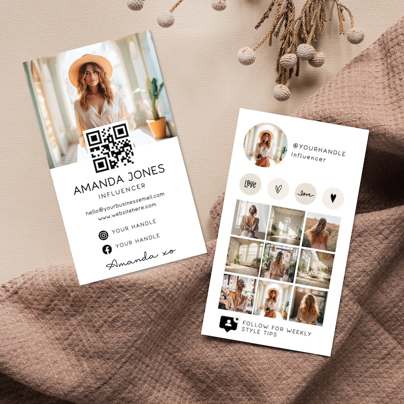 May include: A white business card with black text and a QR code. The card features a photo of a woman wearing a hat and a white shirt. The text on the card reads "Amanda Jones, Influencer, hello@yourbusinessemail.com, www.websitehere.com, Your Handle, Your Handle, Amanda xo".