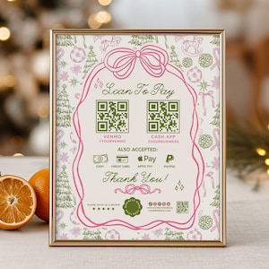 May include: A framed sign with a gold border, featuring a pink bow and text that reads "Scan To Pay" with QR codes for Venmo and Cash App. The sign also lists accepted payment methods and says "Thank You!"