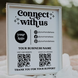 Peut inclure: Une pancarte encadr&eacute;e de blanc avec du texte noir qui dit "Connect with us". La pancarte comprend un espace r&eacute;serv&eacute; pour le logo, des poign&eacute;es de m&eacute;dias sociaux et deux codes QR. Le texte indique &eacute;galement "Your Business Name", "Visitez notre site Web", "Laissez-nous un avis" et "Merci pour votre soutien".